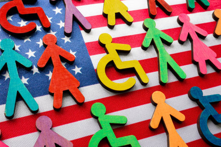 US flag and multi-colored figures with the symbol of a disability person.の写真素材