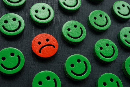 Happy smileys and one sad. Customer experience and satisfaction concept.の写真素材