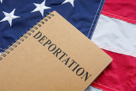 US flag and deportation law on it.の写真素材