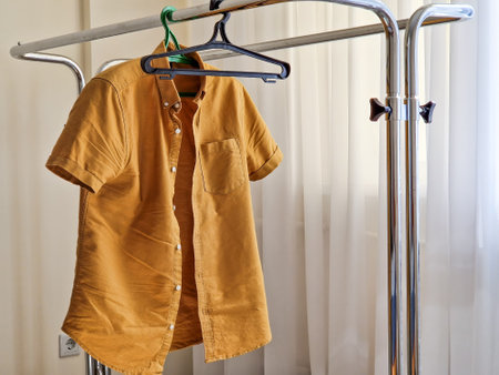 Hanger with one men shirt. Responsible consumption.の写真素材