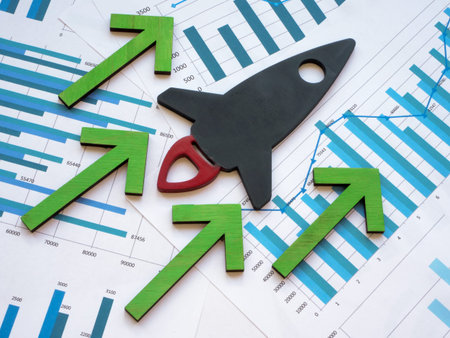 Rocket and rising arrows on business charts.の写真素材
