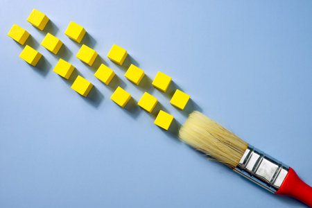 A Brush and yellow cubes like paint. Creative modern art.の写真素材