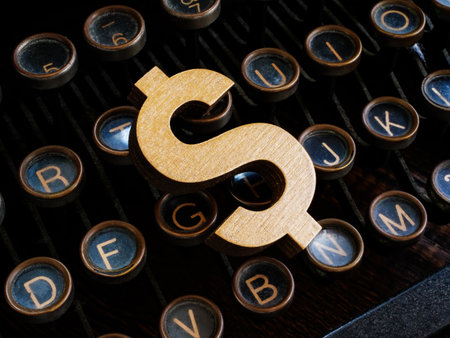 An old typewriter and a dollar sign as symbol of content monetization.の写真素材