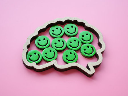 Brain outline with happy emoticons inside. Positivity concept.