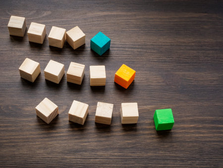 Columns of cubes as symbol of competition between teams and companies. Leadership and competition.