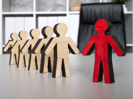 Wooden men as symbols of employees. Team and company management. Leader and manager skills.の写真素材