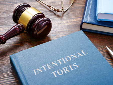 Intentional torts book with gavel as symbol of law.の写真素材
