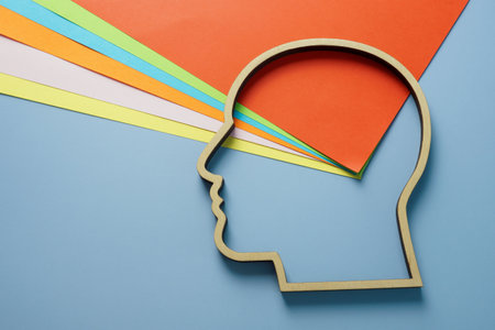 Head outline and colored paper as symbol of creativity and neurodiversity.の写真素材