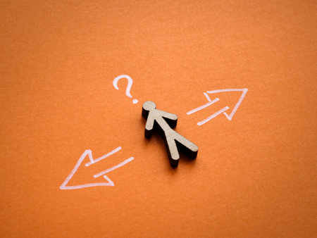 Figurine, arrows and question mark as a symbol of choice.の写真素材