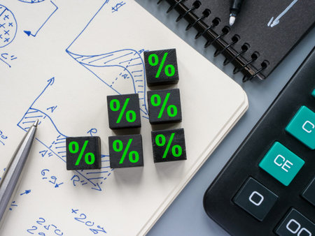 Cubes on a notepad as a concept for the growth of interest on a loan or deposit, profit.
