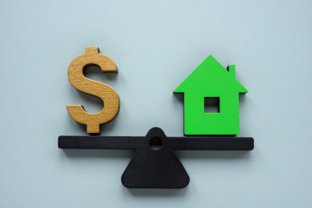 Scales with house and dollar sign. How much is my property worth concept.の写真素材