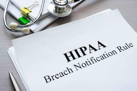 Documents HIPAA breach notification rule on the table.の写真素材