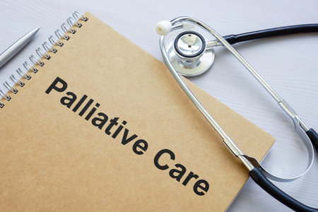 A book about palliative care and a medical stethoscope.の写真素材