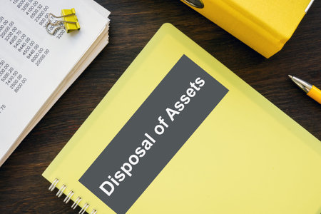 Stack of papers and Disposal of assets book.