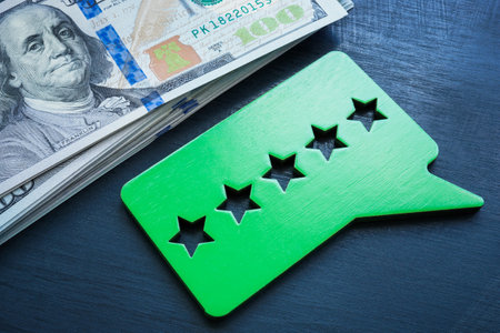 Money and plate with five stars rate. Performance based pay.の写真素材