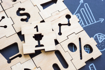 Pieces of the business puzzle and one as a winner, success in business and leadership.の写真素材