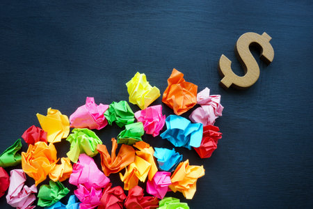 Idea management and Creative economy concept. Colorful paper balls and dollar sign.の写真素材