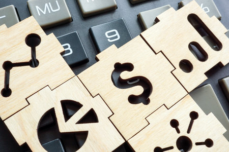 Financial symbols puzzle on calculator. Business reporting and statistics.の写真素材