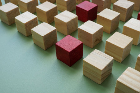 Orderly structure of cubes and red as a concept of talent search and recruitment.
