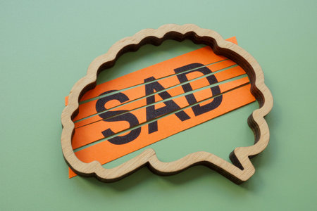 Brain outline with abbreviation SAD Social Anxiety Disorder.