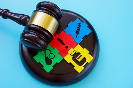 Gavel with puzzle pieces about medicine and medical negligence or malpractice.の写真素材