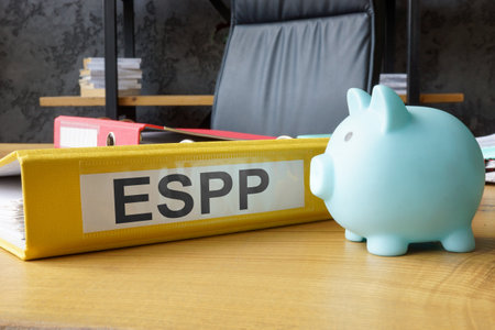 Piggy bank and folder with employee stock purchase plan ESPP.の写真素材