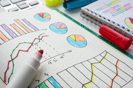 Close-up of marketing and business charts in a notebook. Strategic planning and analysis.
