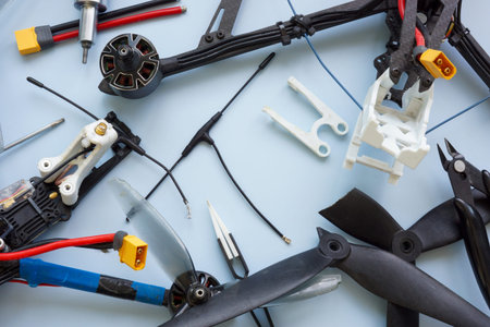 Close-up of broken FPV drones under repair.