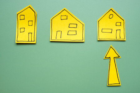 Models of houses with an arrow for selection when buying or renting.