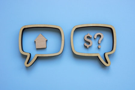 Speech bubbles with house and dollar sign. Real estate negotiations and Mortgage discussions.の写真素材