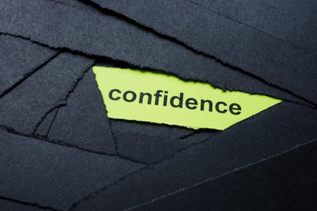 Black paper strips with confidence text. Self-assurance and personal empowerment.の写真素材