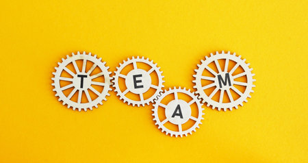 Interconnected gears and the word team. Teamwork concept.の写真素材