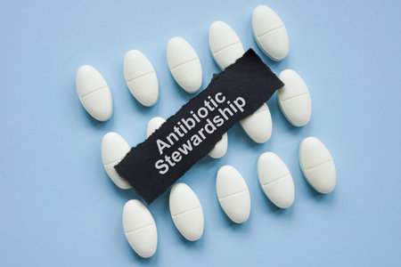 Pills with the words antibiotic stewardship. Represents responsible medication use.