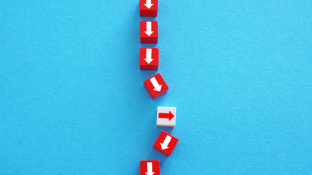 Independent thinking and nonconformity. One arrow in opposite direction among many.の写真素材