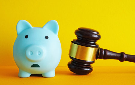 Piggy bank and gavel. Financial justice and legal consequences for savings.の写真素材