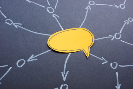 Social media communication and marketing strategy. Yellow speech bubble with arrows.の写真素材