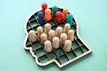 Segmentation inside human head shape symbolizing bias and social stereotypes.の写真素材