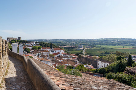 Scenic view of the valley from wall of fortress. White houses red tiled roofs Beautiful old town...