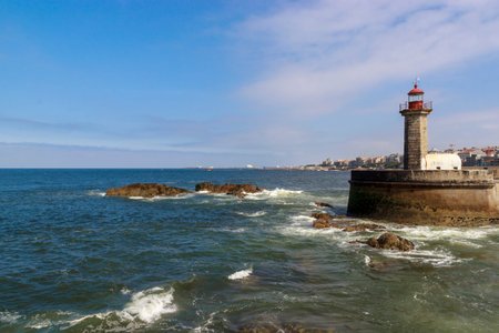 Lighthouse in Foz do Douro at the mouth of the river Douro in Porto, Portugal. Atlantic ocean. Travel photography.の写真素材