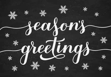 Season s Greetings calligraphy hand lettering on chalkboard background with snowflakes. Christmas and New Year typography poster. Easy to edit vector template for greeting card, banner, flyer, etc.のイラスト素材