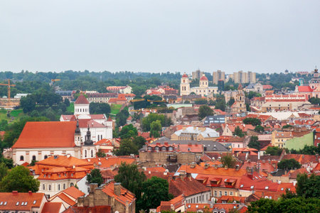 Cityscape of Vilnius, Lithuania from viewpoint in a summer cloudy day. View of the old town with...