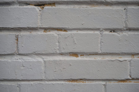 Closeup brick wall painted with gray paint. Old bricks wall texture background. Stonework close up....