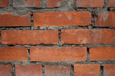 Red brick wall background. Stonewall close up. Backdrop for interior or exterior design projects