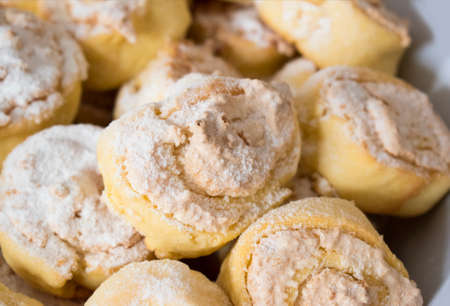 Coconut rolls sprinkled with powdered sugar.の写真素材