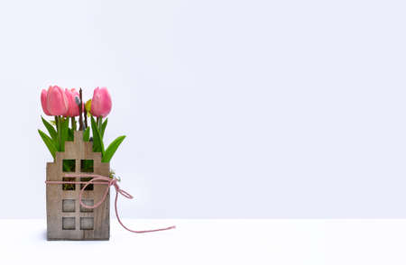 Blank light background with tulip wooden decoration.の写真素材