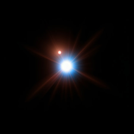 star with lens flare and bokeh effect on black background.