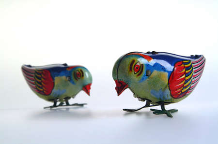 Two old wind up tin toy birds.の写真素材