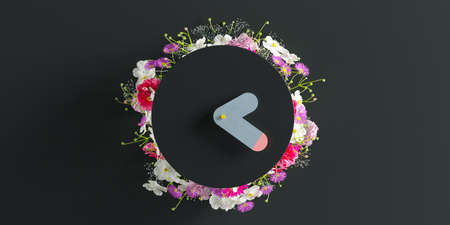 black alarm clock with flowers and leaves on dark black background and pink, colored time concept,...