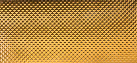 golden triangles in a leather texture in gradual light changes with tiny, wavy outlines