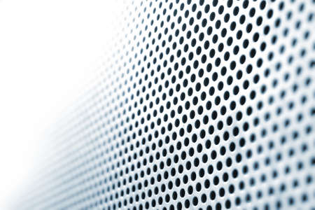 abstract steel plate with circle holes, in shifting focus, fading into absolute white
